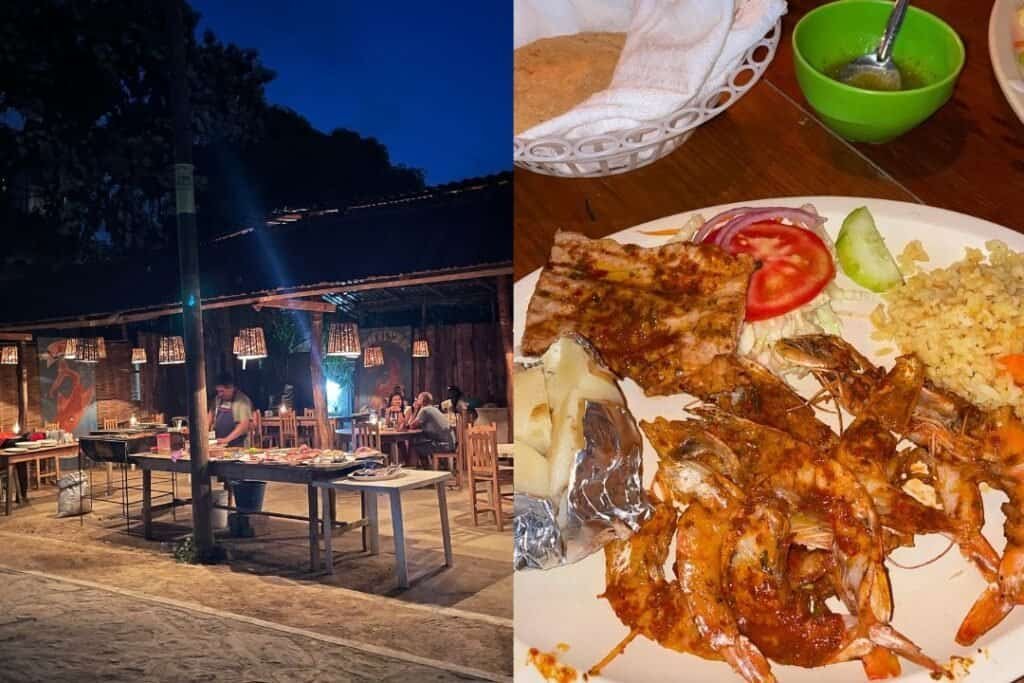 Nighttime outdoor dining area at Barefoot Backpackers with wooden furniture and string lights, creating a cozy atmosphere for travelers.