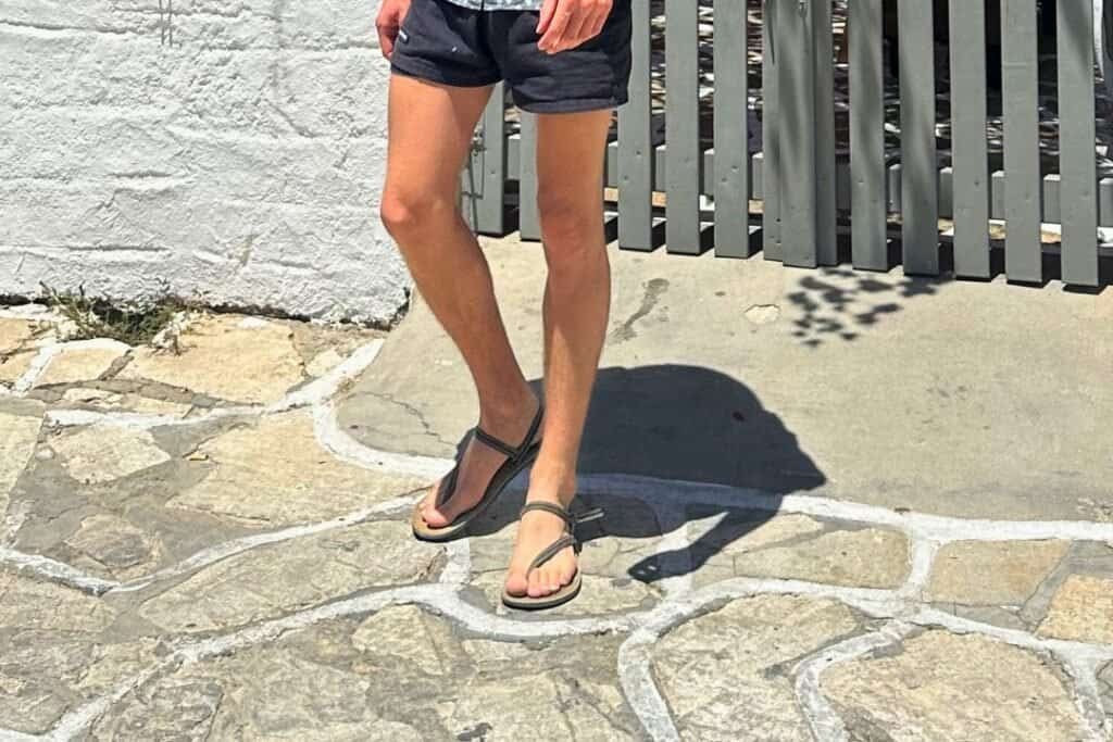 Comfortable barefoot backpacker sandals on a sunny day, perfect for outdoor adventures and travel. Stylish footwear ideal for exploring nature and urban environments, emphasizing a free-spirited backpacking lifestyle.