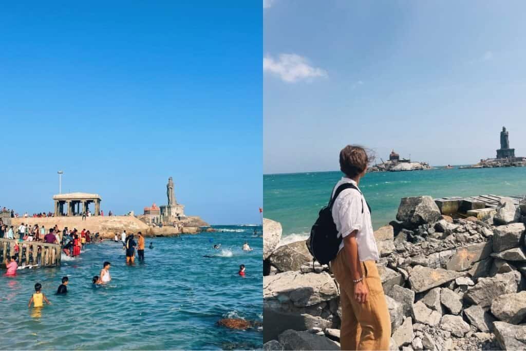Kanyakumari Vibrant beach scene with people swimming near historical monuments on a sunny day.