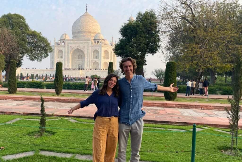 Taj Mahal People enjoying sightseeing at the Taj Mahal in India, capturing the essence of mindful and sustainable travel.