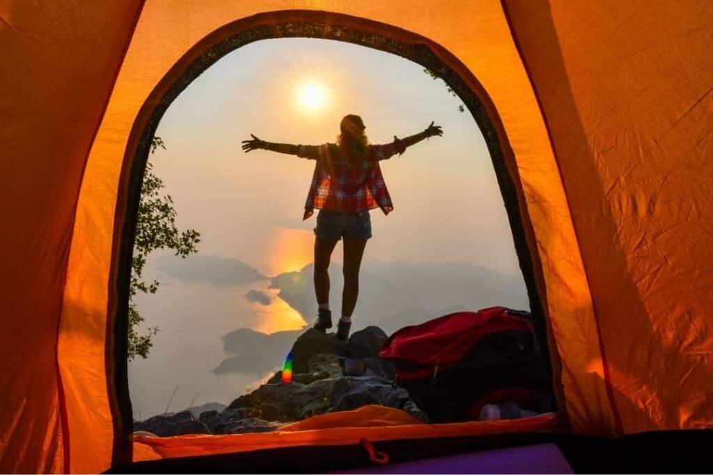 shot of the tent from the inside looking over a sunset