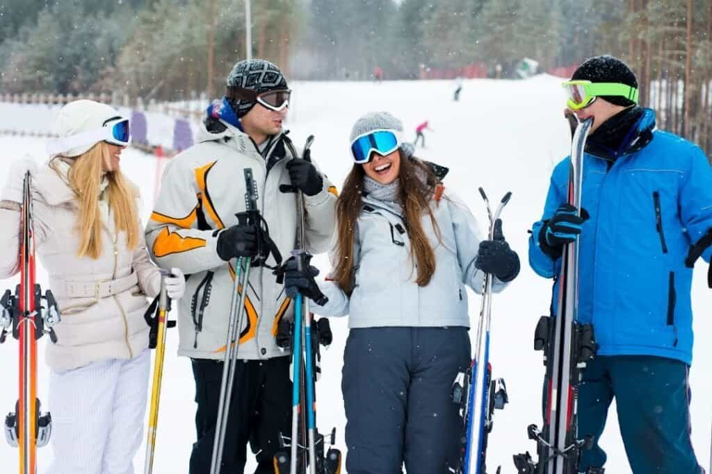 Enjoying a snowy day on the ski slopes with friends, embracing mindful outdoor adventure and sustainable winter sports practices.