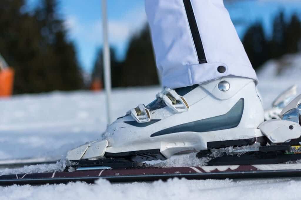 ski boots Ski boots on snow-covered ground overlooking a winter landscape, capturing the essence of mindful winter adventure and sustainable outdoor travel.