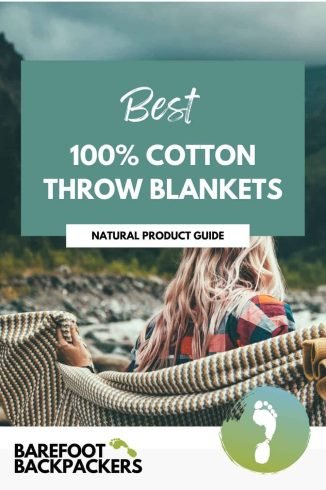 Soft, natural 100% cotton throw blanket nestled outdoors amid lush mountains, eco-friendly, perfect for mindful, sustainable travel adventures.