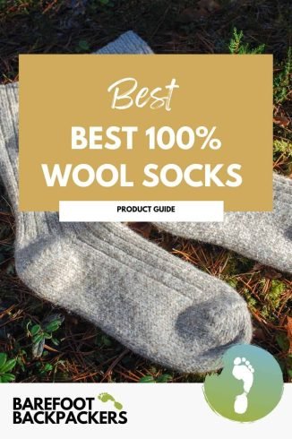 Soft cream wool socks 100% pure lying outdoors among natural foliage, emphasizing eco-friendly and sustainable travel essentials.