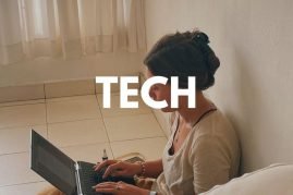 Backpacker working remotely on a laptop while traveling