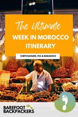Moroccan market with a vendor selling traditional sweets, showcasing the vibrant local culture and flavors, perfect for travelers exploring Morocco with Barefoot Backpackers.