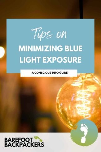 Bright idea light bulb illuminated with warm amber glow, eco-friendly travel tips for barefoot backpackers to reduce blue light exposure for better sleep and eye health.