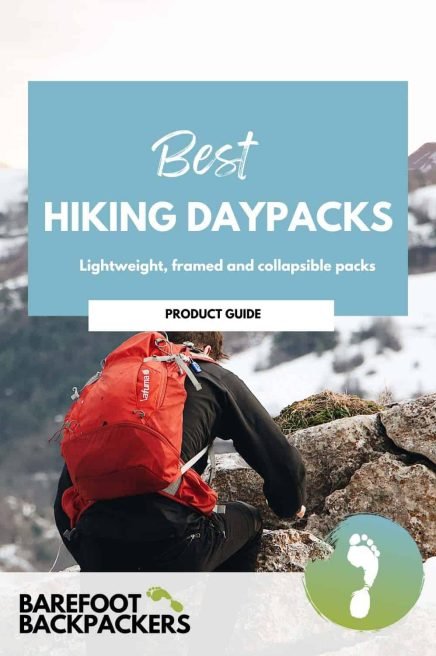Comfortable hiker with a red backpack on rocky mountain terrain, promoting lightweight and collapsible hiking daypacks for outdoor adventures.